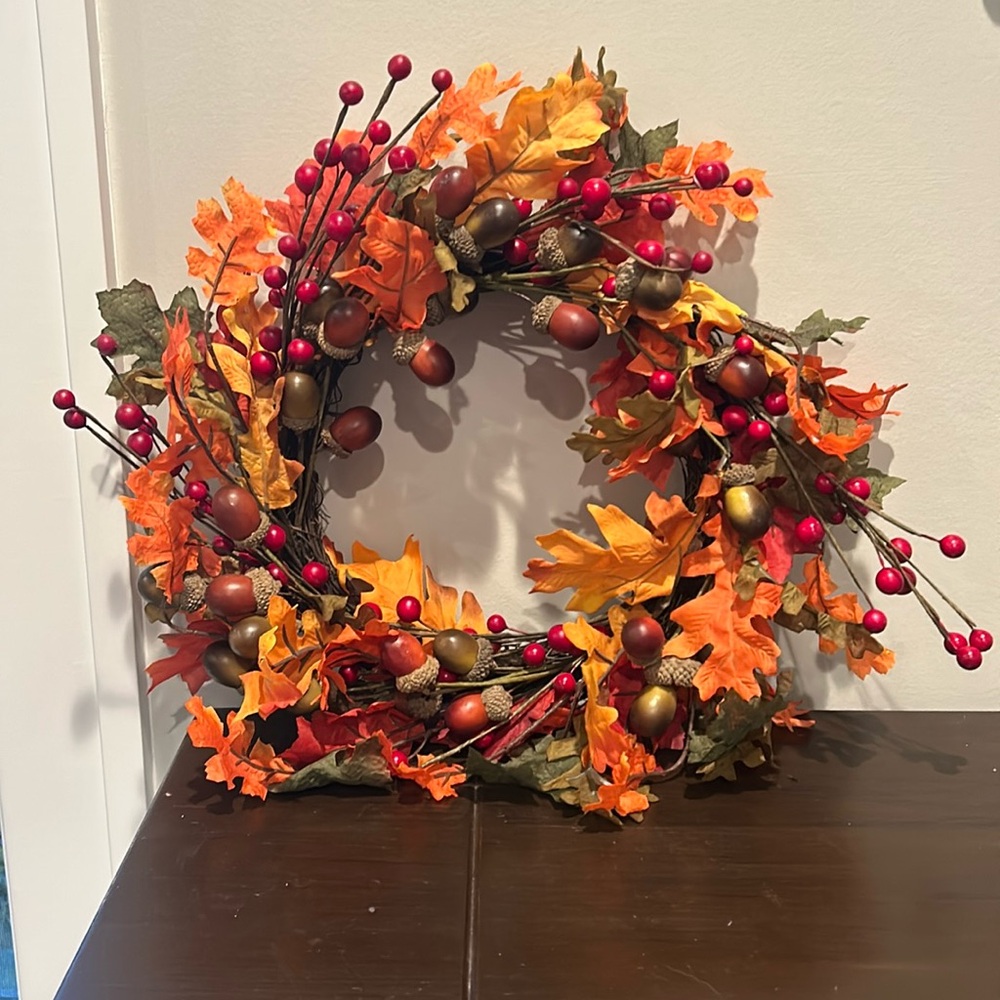 Decorative fall wreath with acorns, berries and leaves.  10” in diameter.
